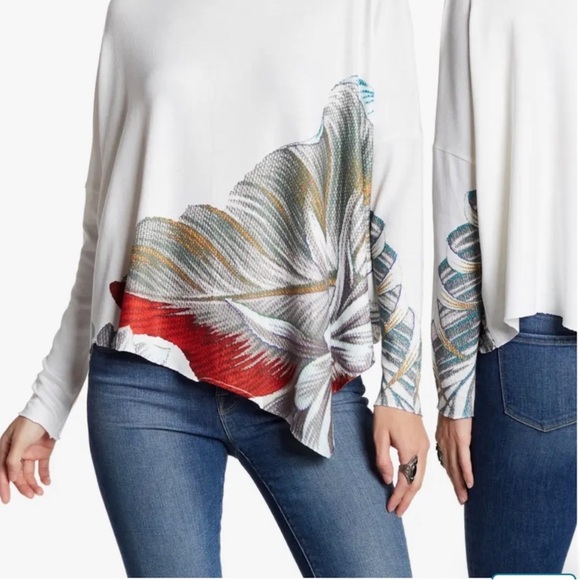 An asymmetrical hem lends a chic vibe to this soft and cozy pullover. - Picture 1 of 6